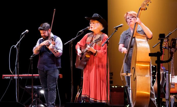 Performers on stage playing instruments