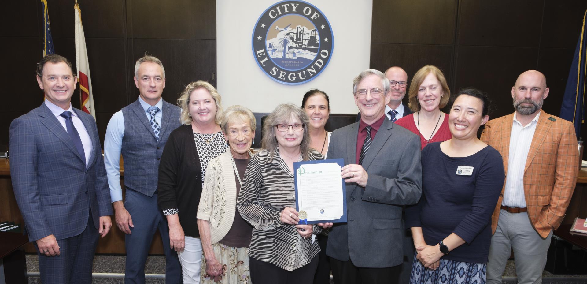 Library Manager Mark Herbert and Library staff accepting proclamation from City Council