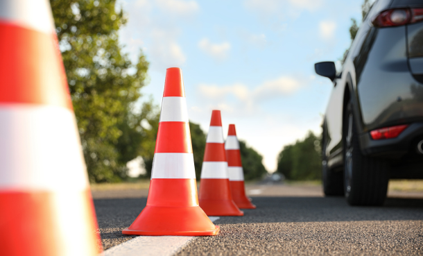 Traffic Cones and a vehicle on a street