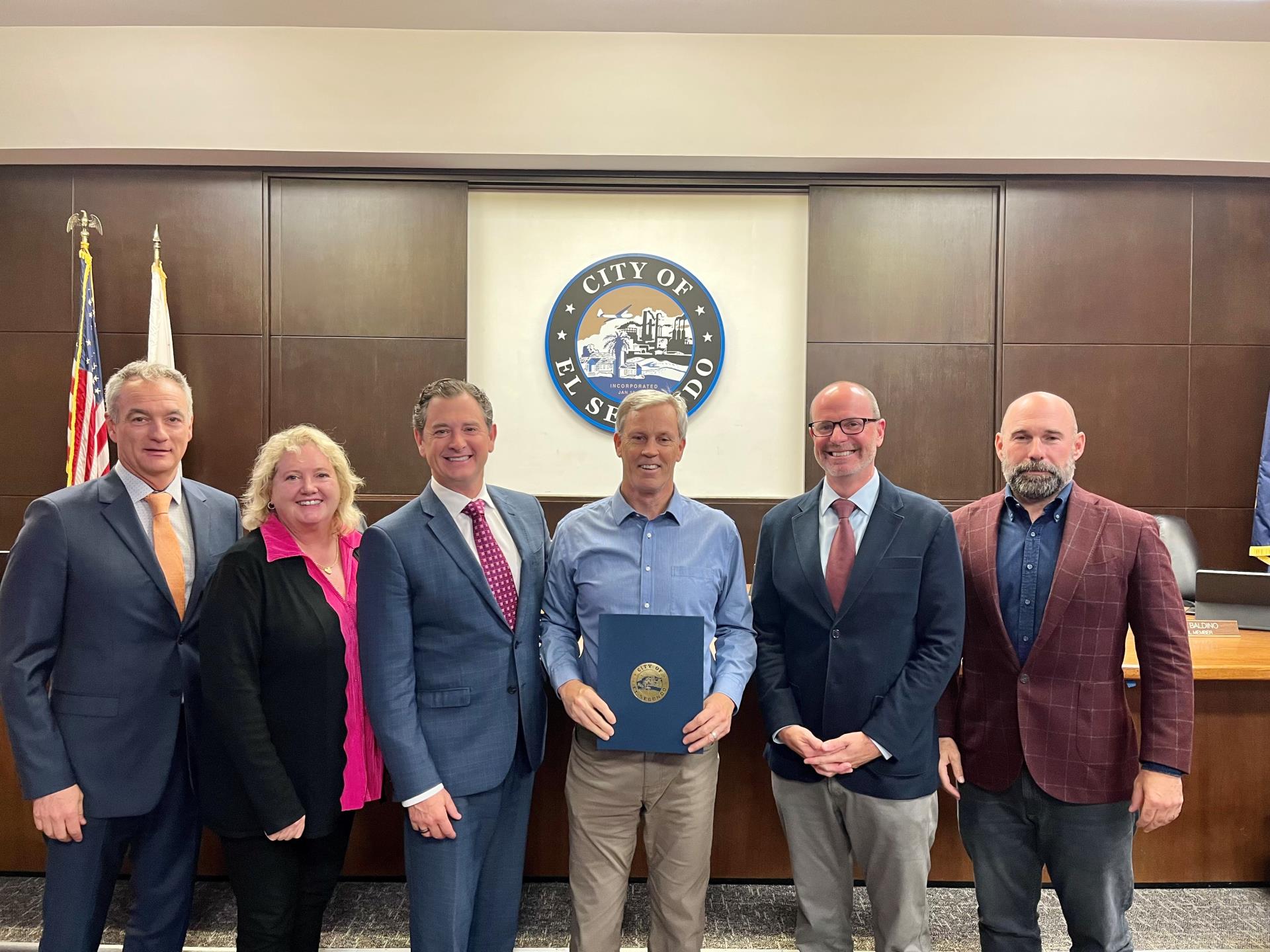 DEI Member Lewis Hill accepting National Bullying Prevention Proclamation from City Council