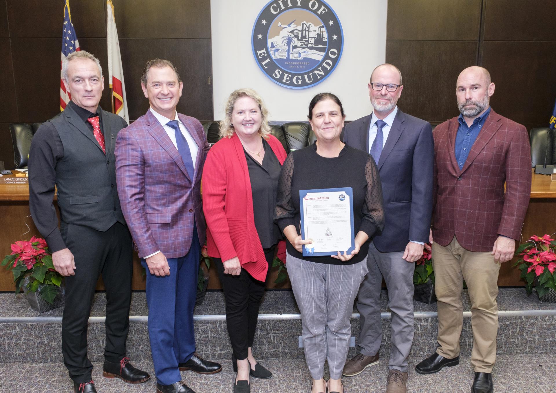 Recreation Parks and Library Director Aly Mancini accepting Christmas Eve Dinner proclamation from City Council