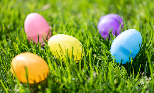 Plastic colored eggs in the grass