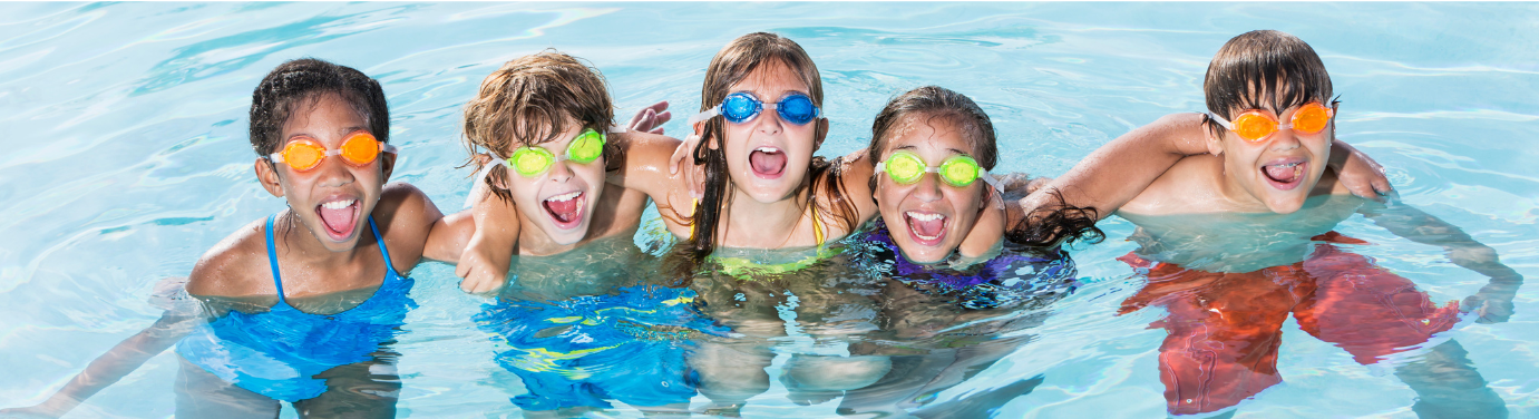 Kids in pool wearing googles