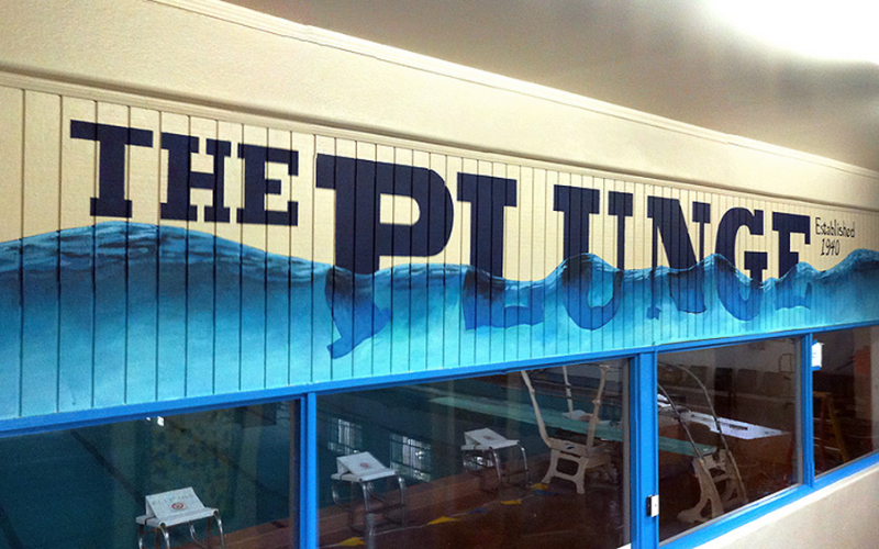 The Plunge interior signage with painted wave and can see dive blocks