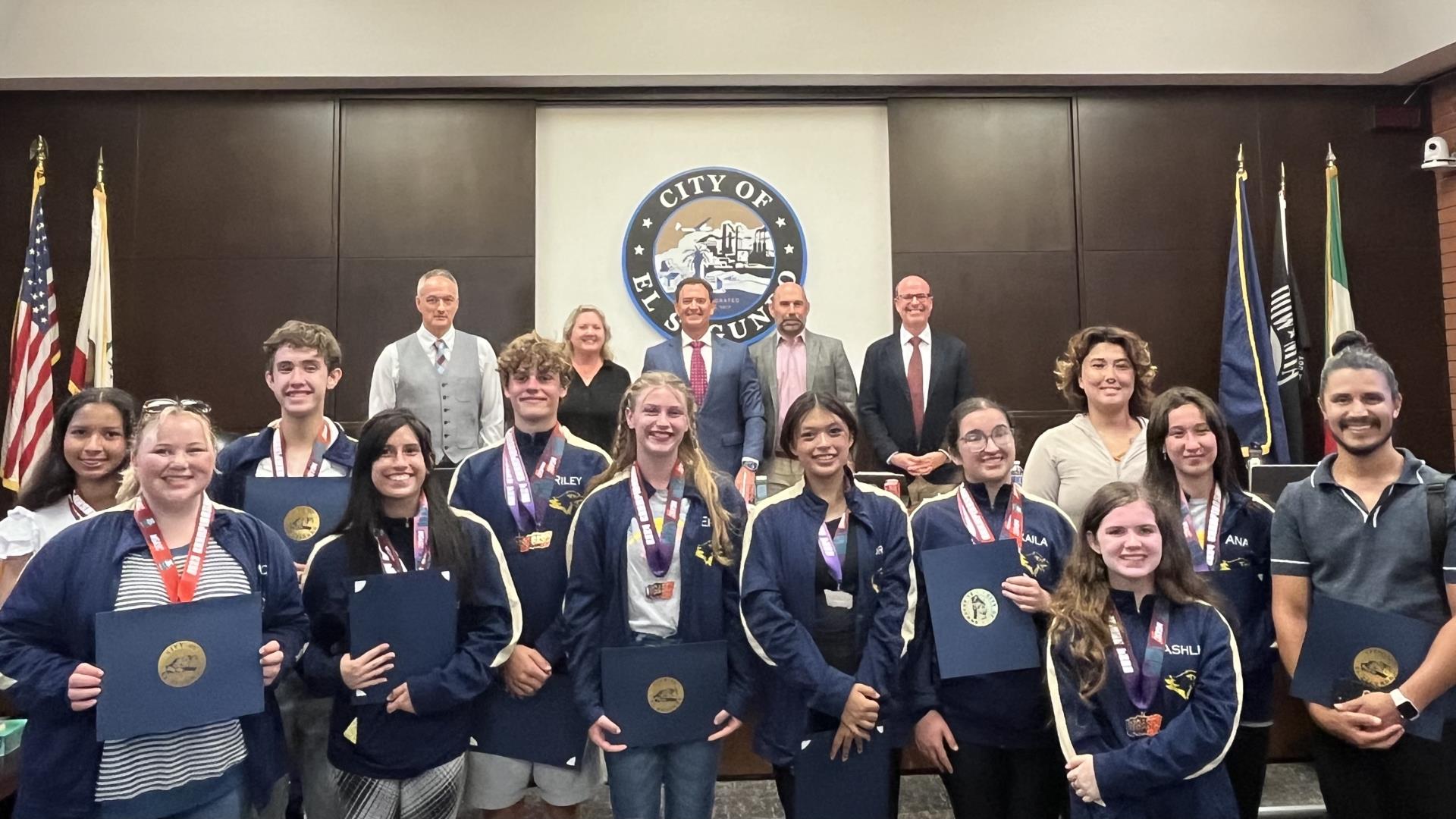 ESHS Winter Guard accepting recognition for winning the 2024 Winter Guard International Regional Championships from City Council